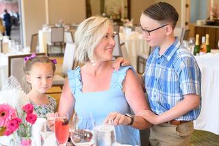 MOther and children at a table enjoying brunch