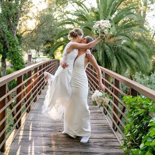 Brides embrace on the Silverado bridge