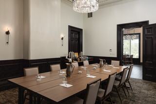 Meeting room in a resort in Napa Valley set up for a boardroom meeting with a table and chairs