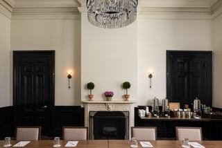 Meeting room in a resort in Napa Valley set up for a boardroom meeting with a table and chairs