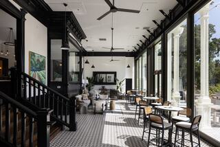 Inside terrace at a hotel resort with modern furnishing in Napa overlooking a golf course