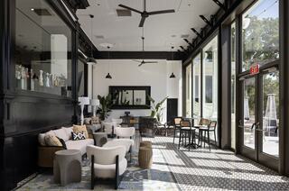 Inside terrace at a hotel resort with modern furnishing in Napa overlooking a golf course