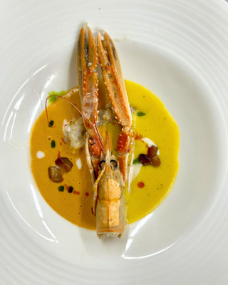 Elegant seafood dish plated for culinary event