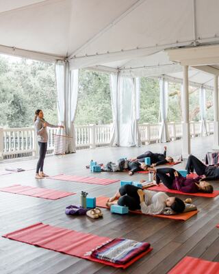 Women in a yoga class on the Fairway Deck at Silverado Resort
