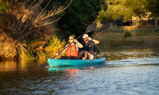 Man and women kayaking down Napa River in Napa Valley California
