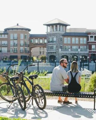 couple sitting near their bikes in downtown Napa