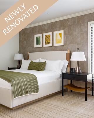 A Modern Hotel Room with a Bed, Closet, and Bathroom in Napa