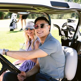 gentleman and woman in a golf cart on the Silverado Golf Course