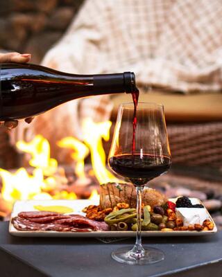 Wine by the fire with charcuterie