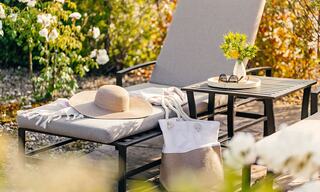 Outdoor Pool Lounge Chair with a Hat, Pool Bag, and Sunglasses