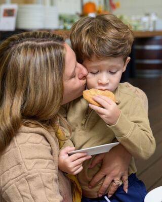 mom kissing child's cheek