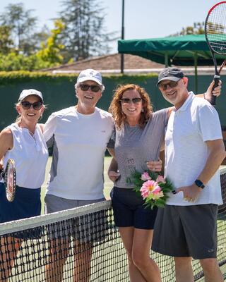 group of friends on the tennis courts
