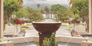 view of the spa fountain with Silverado Resort mansion in the background