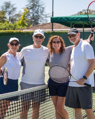 group of friends on the tennis courts