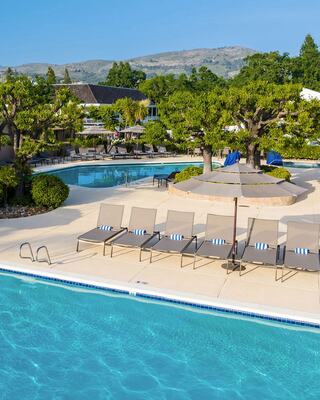Outdoor Pools with Lounge Chairs and Umbrellas at a Napa Valley Resort