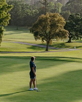 Two People Golfing on a Golf Course with Trees in Napa Valley