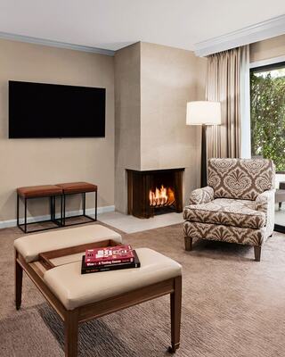 A Modern Kitchen in a Hotel Suite with a Bottle of Wine and Wine Glasses on the Counter