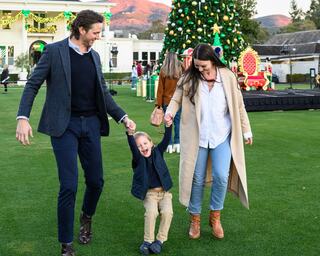 Silverado Resort Mansion in Napa Valley during the holidays with a family in front of it enjoying themselves