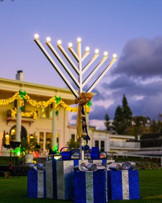 Large Menorah with oversized wrapped gifts